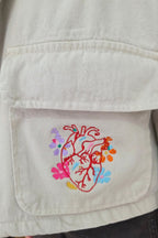 CHAQUETA CROP SOMOS INSTANTES